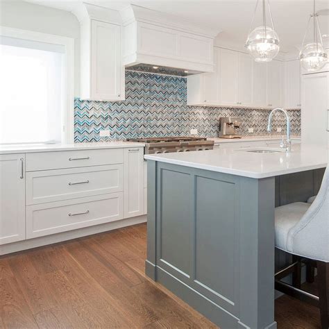 kitchen backsplash with blue cabinets.